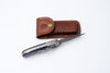Hand-Engraved Folding Knife with Leather Sheath – Damascus-Inspired Detailing - TF-092